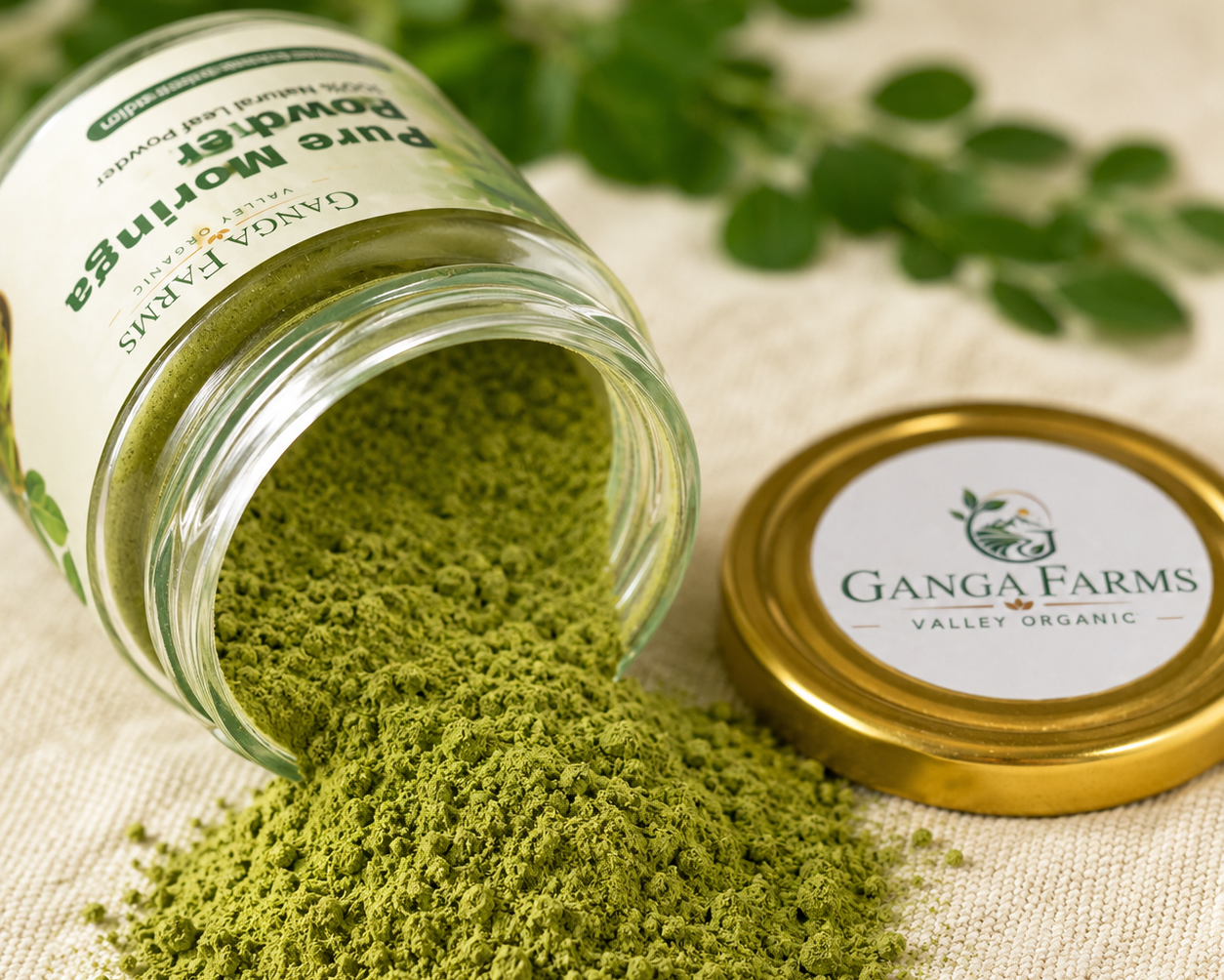Open jar of green powder with Ganga Farms branding on a light background